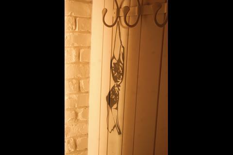 The use of Banksy-style graffiti, neon and retro furniture is visually arresting